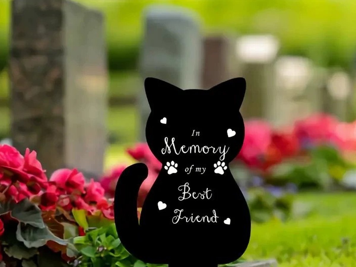 Black cat silhouette memorial stake standing on grass with the words In Memory