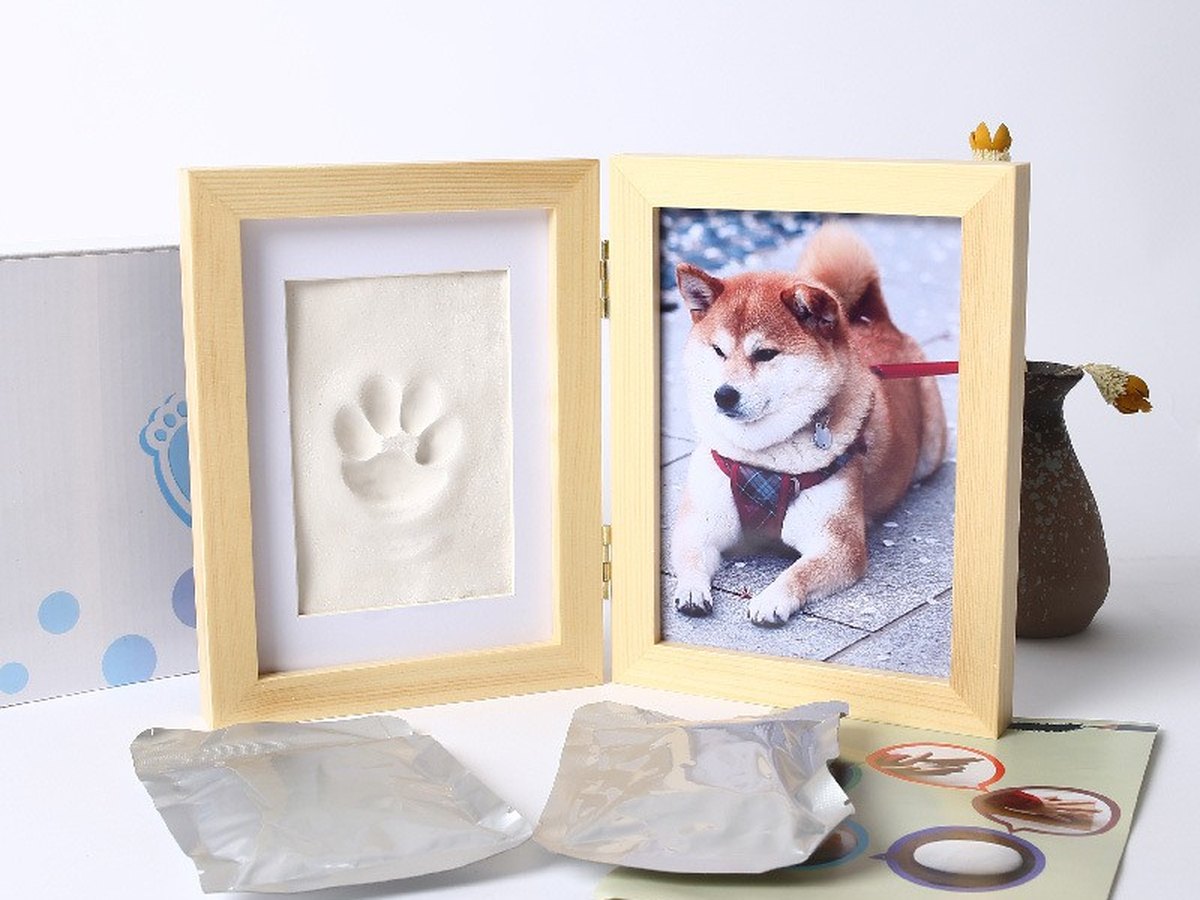 Solid oak double frame holding a clay paw impression beside a photo of a dog