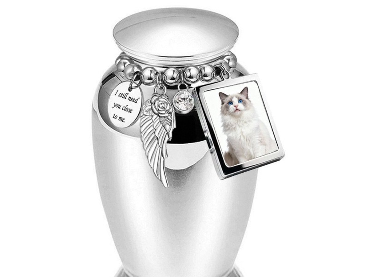Small silver urn pendant on a chain with a photo charm attached